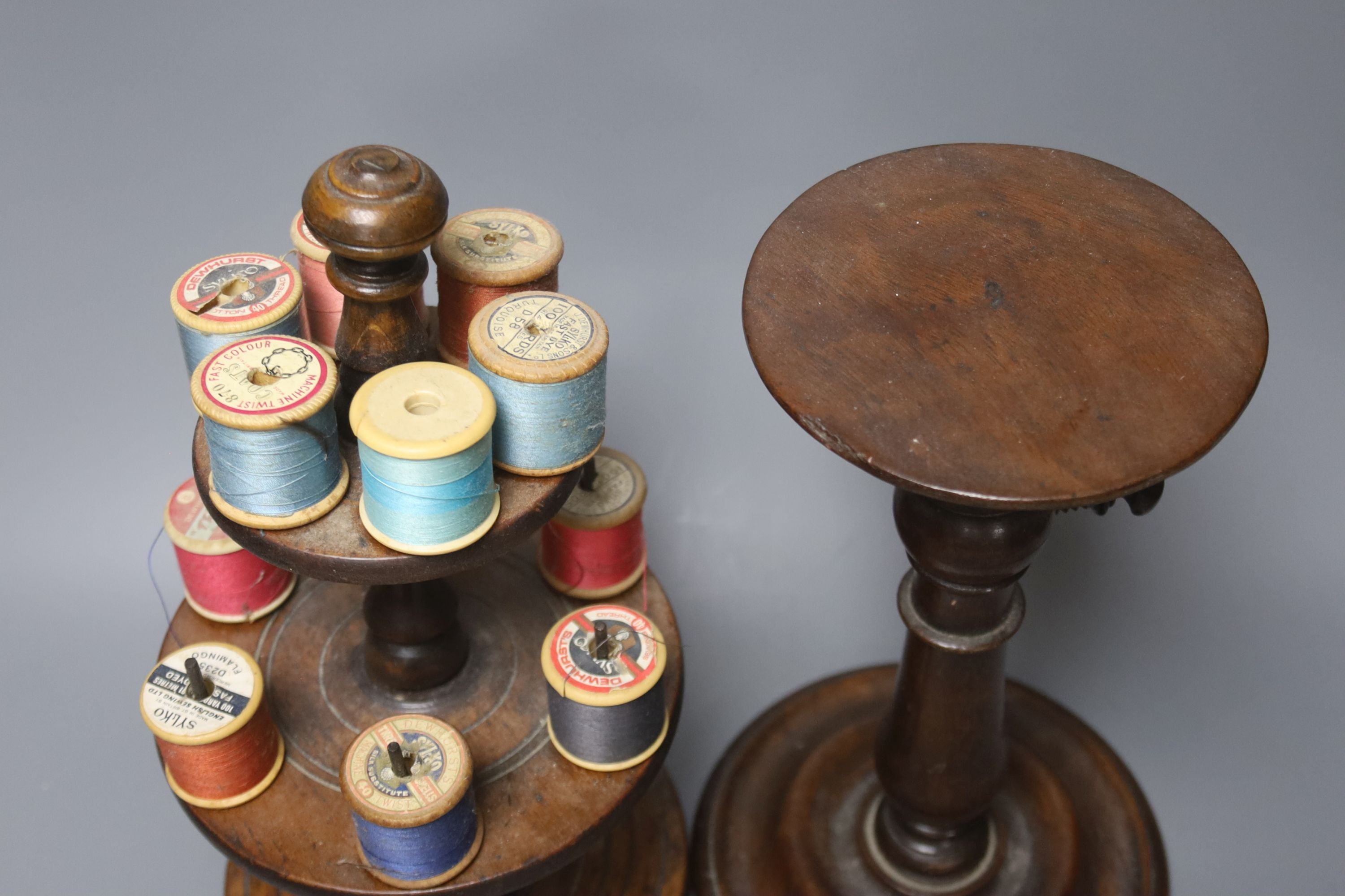A Victorian turned wood cotton reel stand, 30cm and a 19th century mahogany telescopic candle stand, height 26cm
